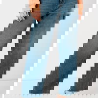 Blugi cu croiala ampla si aspect decolorat