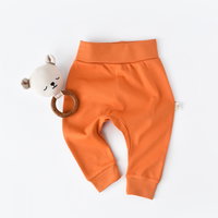Pantaloni Bebe Unisex din bumbac organic Portocaliu BabyCosy